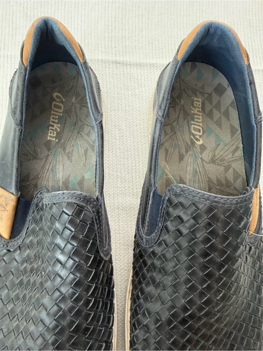 OluKai Men's Woven Slip-On Loafers in Black with Tan Accents